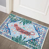 A rectangular entryway rug featuring a blue and white pattern with pink tiger and tropical palm leaf designs.