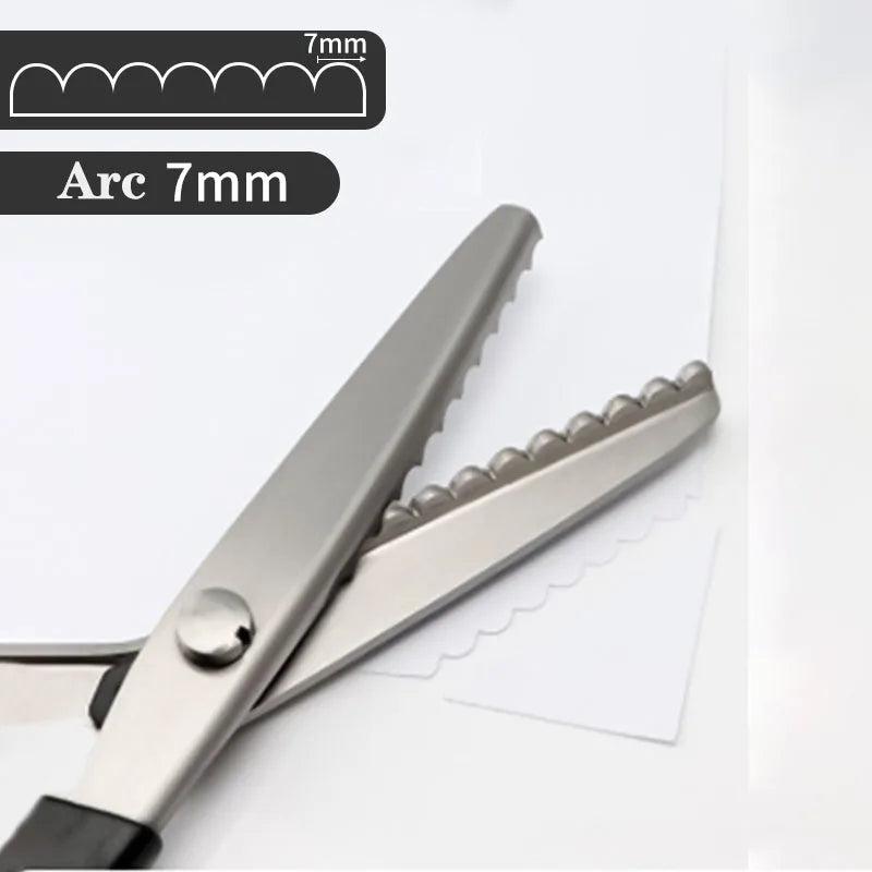 A pair of professional stainless steel tailor's shears with a 7mm arc measurement visible.