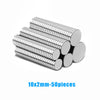 A pile of silver, corrugated magnetic fridge magnets, 50 pieces in total.