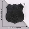 A black embroidered leather patch with the text ROUTE US 66 on it, shown against a white background.