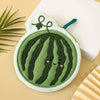 A cute green watermelon shaped coral fleece hanging hand towel with a smiling face