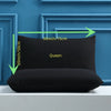 A black Queen size pillow cover displayed against a blue wooden frame with dimension markings.