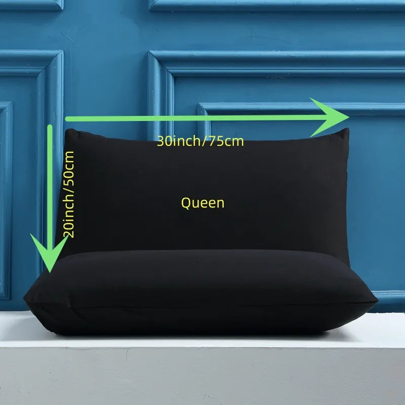 A black Queen size pillow cover displayed against a blue wooden frame with dimension markings.