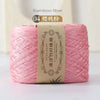 A skein of pink bamboo fiber yarn labeled as number 04, ready for crafting.