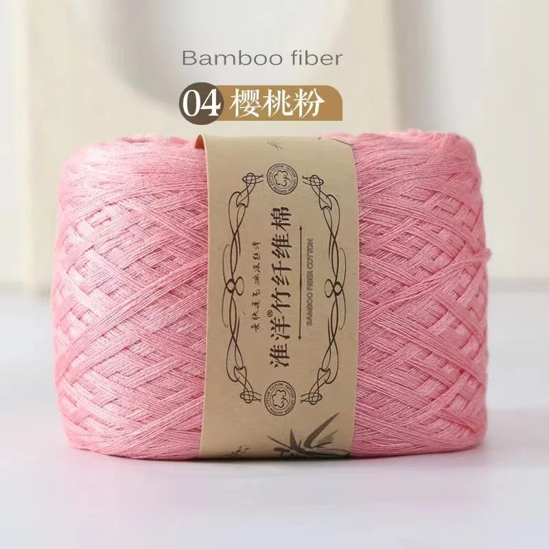 A skein of pink bamboo fiber yarn labeled as number 04, ready for crafting.
