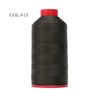 A spool of black heavy duty nylon sewing thread with a red cap.