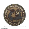 Embroidered patch featuring a stylized figure with a beard and turban on a circular background.