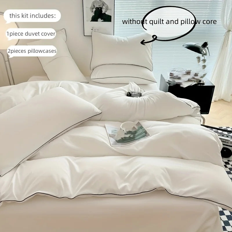 A white duvet cover set featuring a duvet, pillowcases, and decorative pillows on a bed.