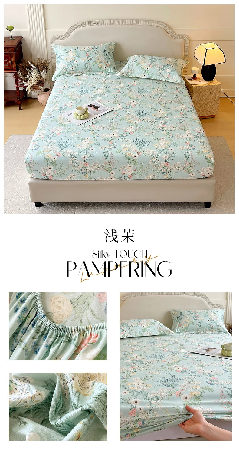 Floral printed cotton fitted sheet displayed on a bed with soft lighting and decorative pillows.
