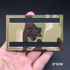 A rectangular tactical patch featuring a camouflage pattern with a black six-pointed star emblem on a khaki background.
