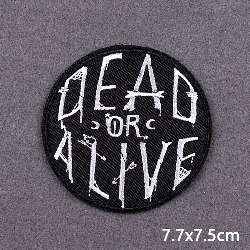 Black embroidered patch with white text reading DEAD OR LIVE
