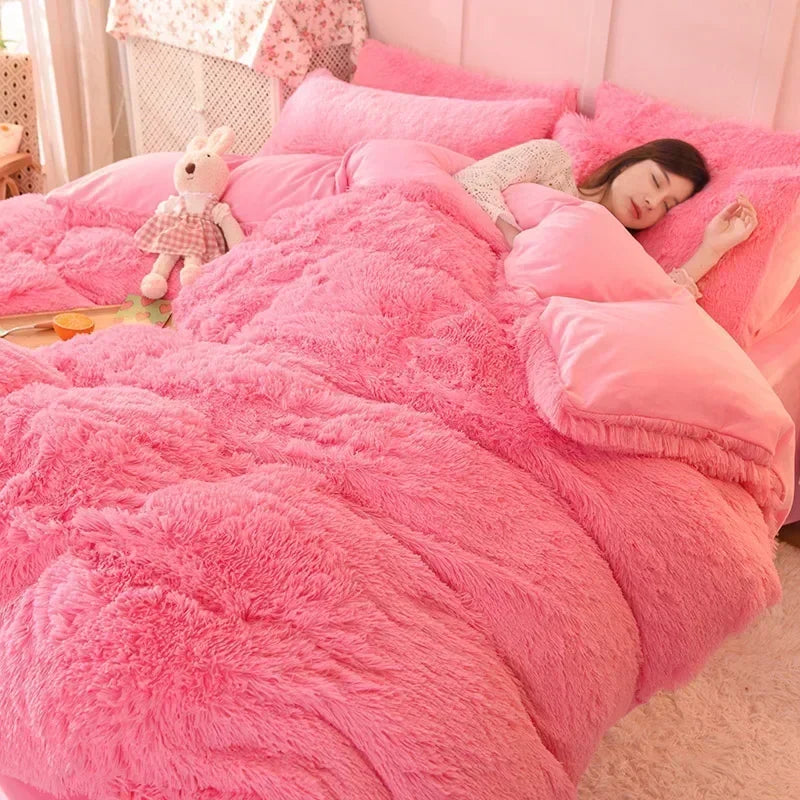 A pink plush mink velvet duvet set with a white teddy bear and a woman relaxing on the bed.