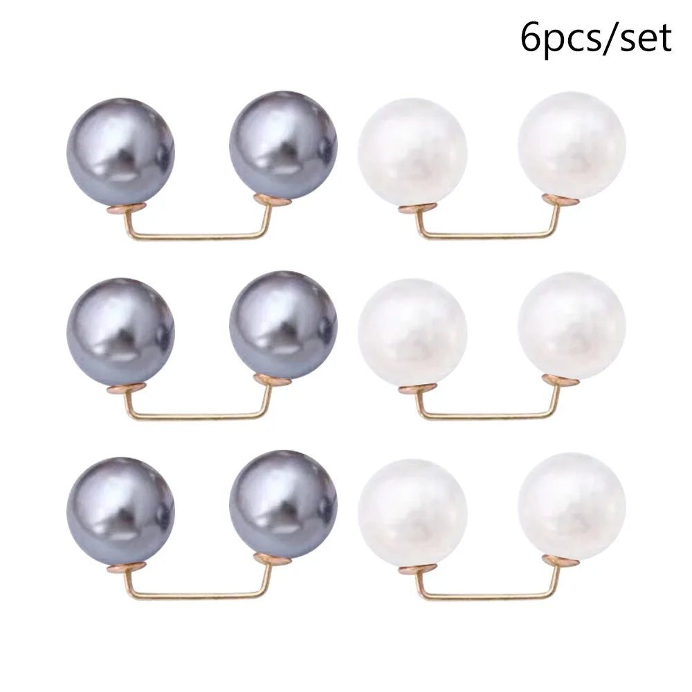 A set of six pearl-like round jewelry pieces with gold-toned findings.