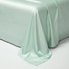 A draped sheet of light mint green luxury Egyptian cotton bedding fabric