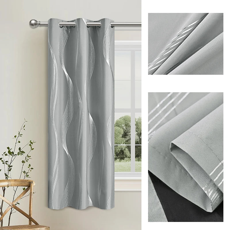 Gray blackout curtains featuring an elegant golden wave pattern hanging on a rod.