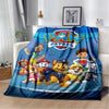 A colorful Paw Patrol themed flannel throw blanket featuring characters like Chase and Marshall.