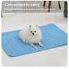 A fluffy white dog is lying on a blue cooling ice mat for pets.