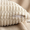 A cream-colored corduroy decorative throw pillow cover with a textured stripe design.