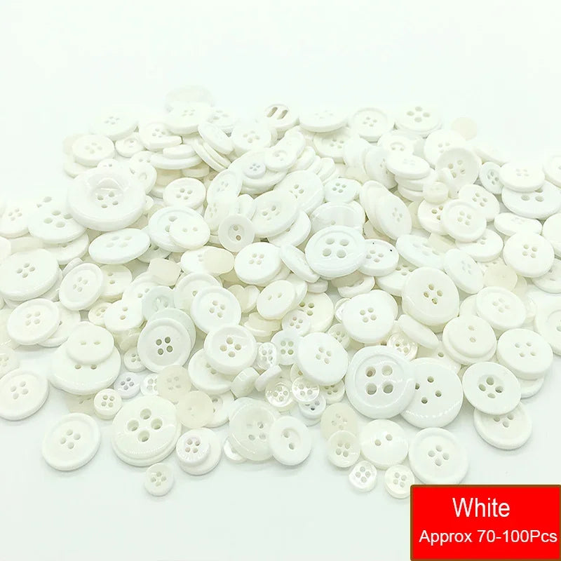 A pile of assorted white resin sewing buttons for crafting and DIY projects