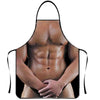 A black apron featuring a realistic male torso with defined abdominal muscles.