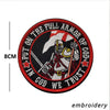 An embroidered patch featuring a warrior figure and text that reads Put on the full armor of God we trust