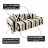 A beige and black striped sofa throw draped over a piece of furniture.