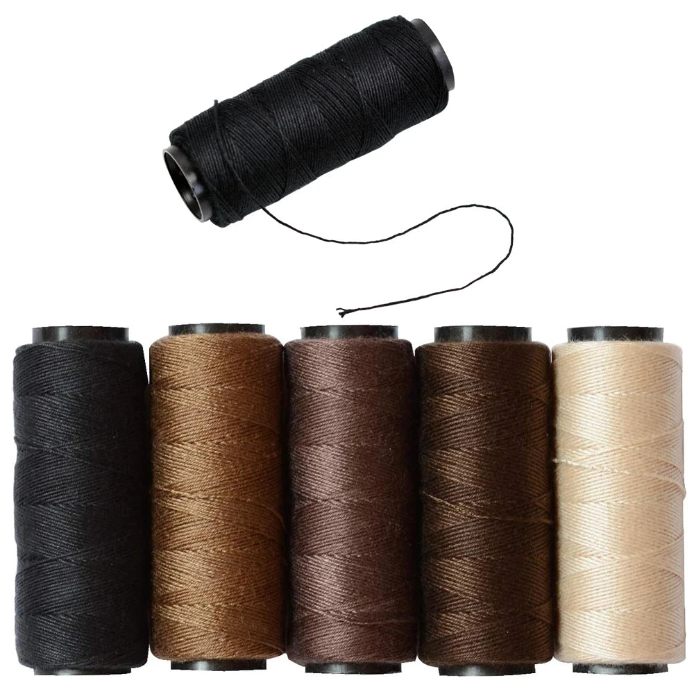 Five three rolls of multi-color sewing threads for hair extensions in various shades of brown and beige.