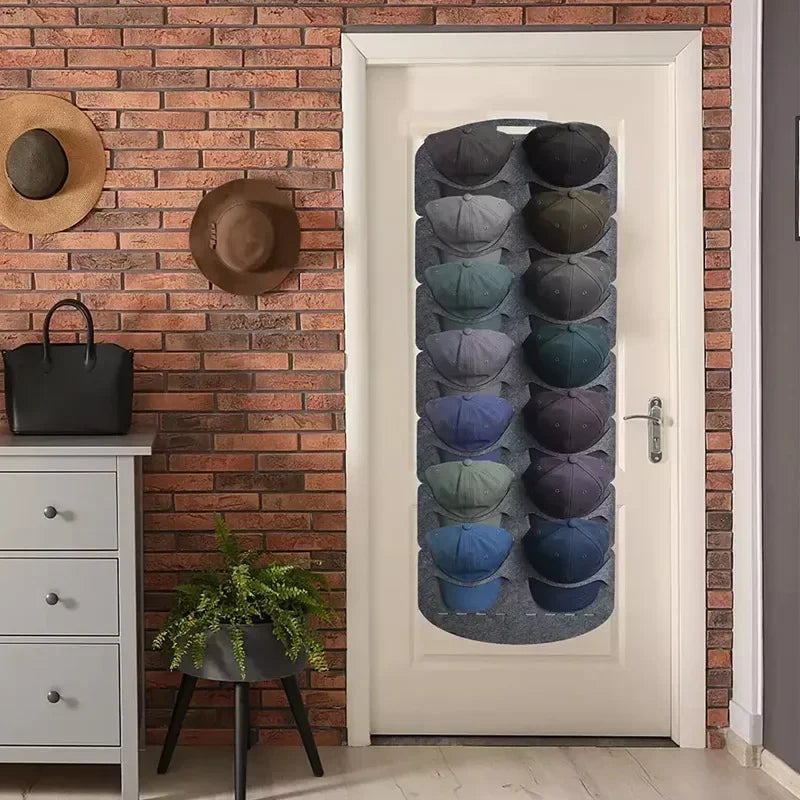 A white door features a vertical felt hat storage rack with multiple slots for hanging hats.
