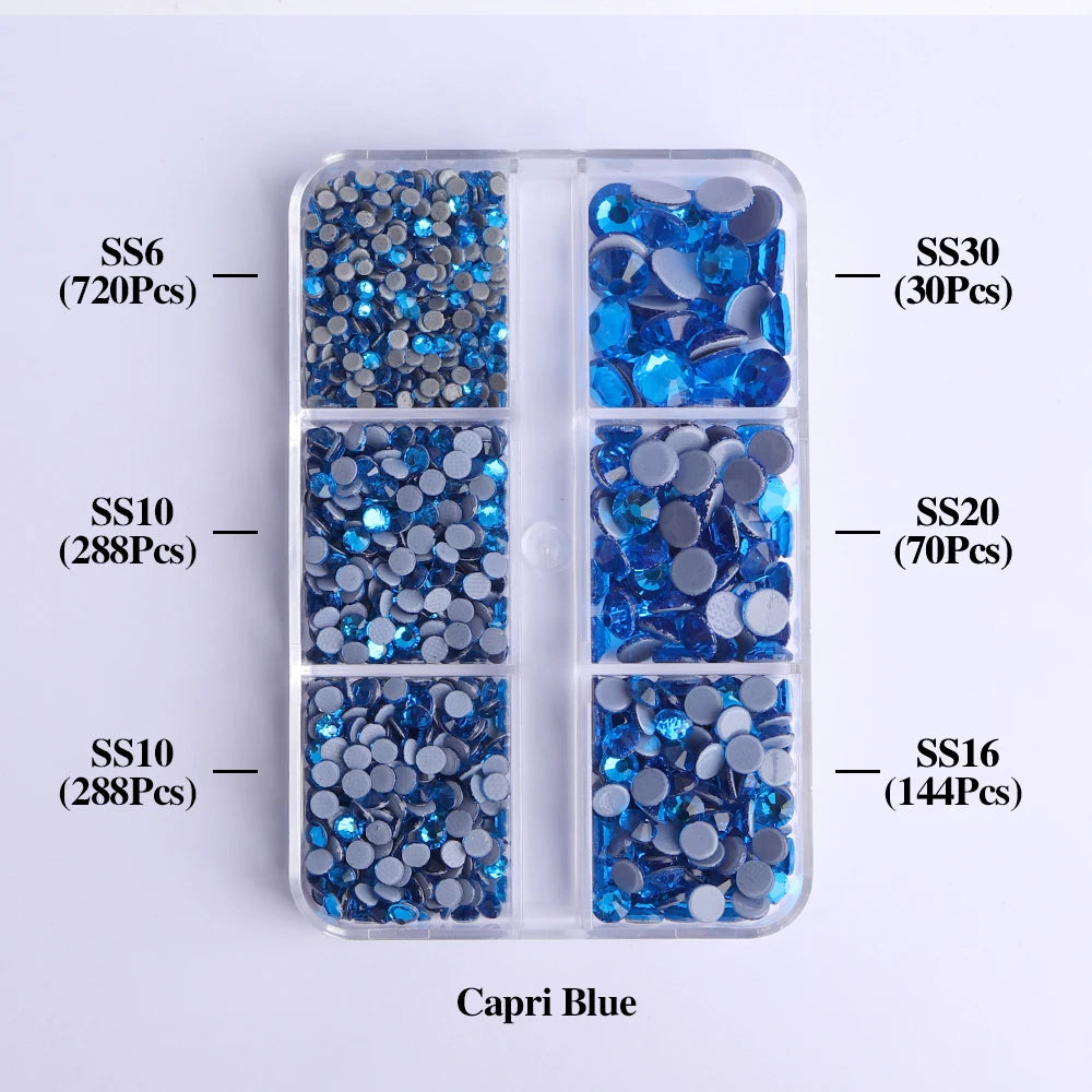 A clear plastic tray containing various sizes of Capri Blue glass rhinestones categorized by SS6, SS10, SS20, and SS30.