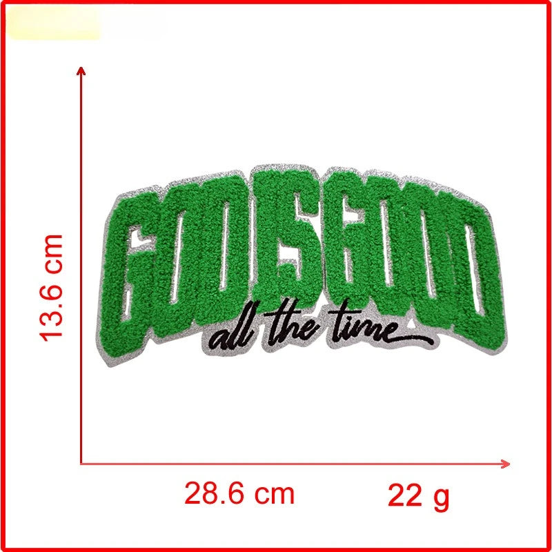 Green embroidered text GODGOOD all the time on a rectangular patch