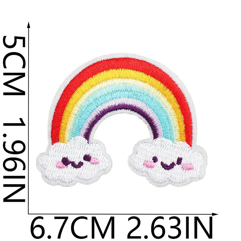 A white cloud patch with a rainbow design embroidered on it.