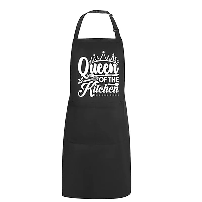Black apron with gold crown embroidery that reads Queen of the Kitchen