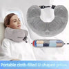 A gray cloth-filled U-shaped travel neck pillow is shown being used by a woman in a car seat.