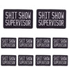 Four black embroidered patches with the text SHIT SHOW SUPERVISOR