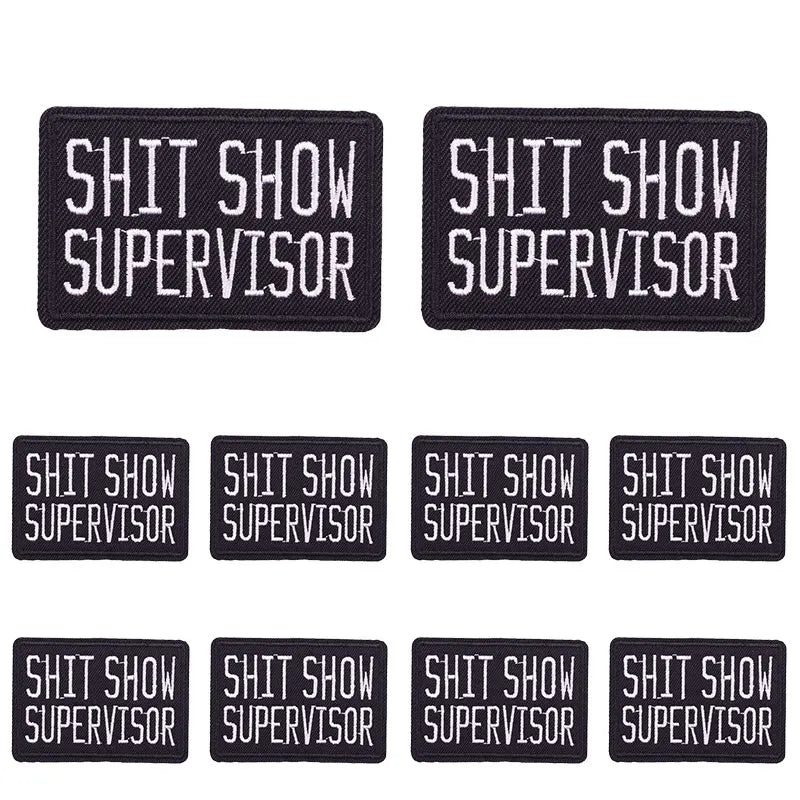 Four black embroidered patches with the text SHIT SHOW SUPERVISOR
