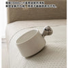 A white linen sofa cover cushion is shown on a light-colored fabric, illustrating a product for mosquito protection.