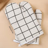 A pair of white and black checkered heat-resistant kitchen oven gloves shown flat with measurements.