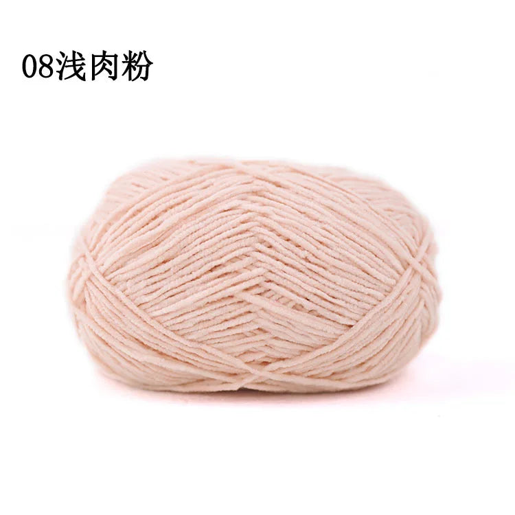 A ball of light pink matte chenille yarn for knitting and crochet
