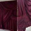 Close-up of deep burgundy draping stretch fabric used for decor