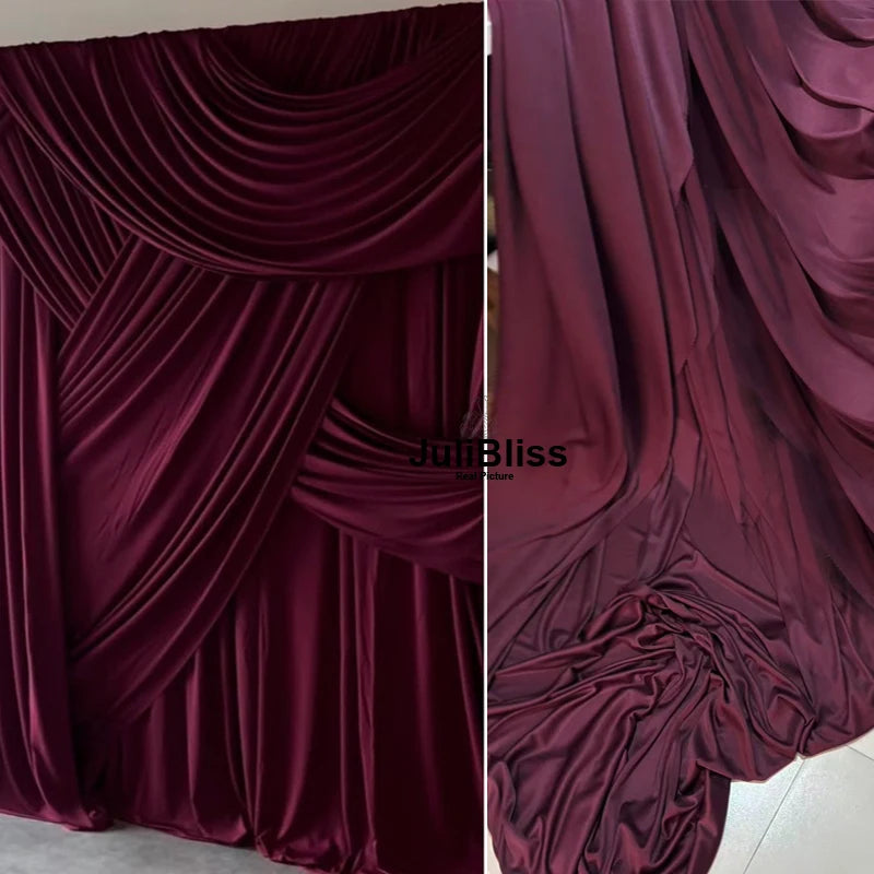 Close-up of deep burgundy draping stretch fabric used for decor