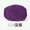 A ball of deep purple organic cotton 4ply knitting yarn labeled as size 62