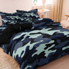 A dark blue and green camouflage digital print duvet set displayed on a bed.