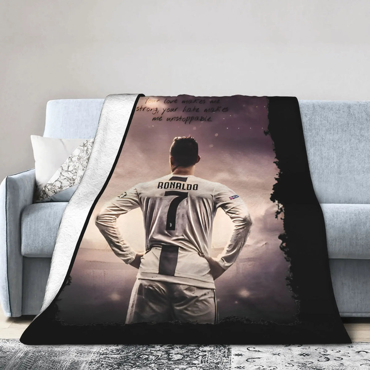A dark photo of a soccer player wearing number 7 stands with his hands on his hips, featured on a wool throw blanket.