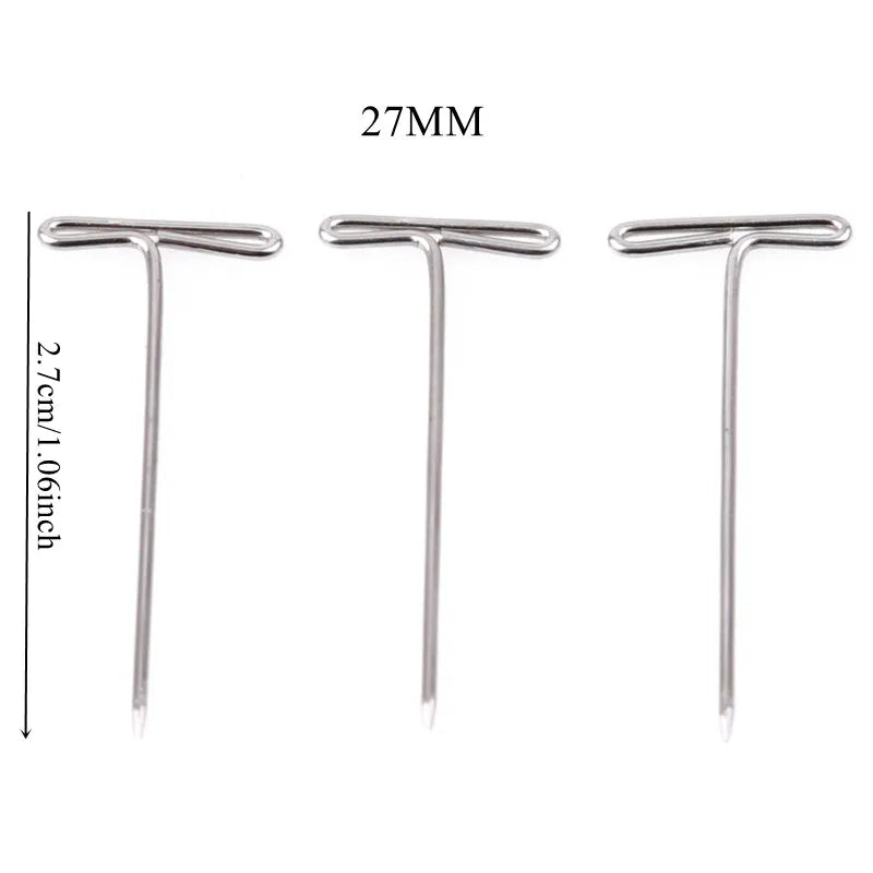 Three stainless steel T-pins measuring 27mm in length for wig making or knitting.