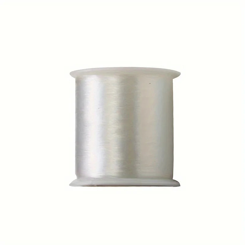 A roll of silver metallic invisible nylon sewing thread.