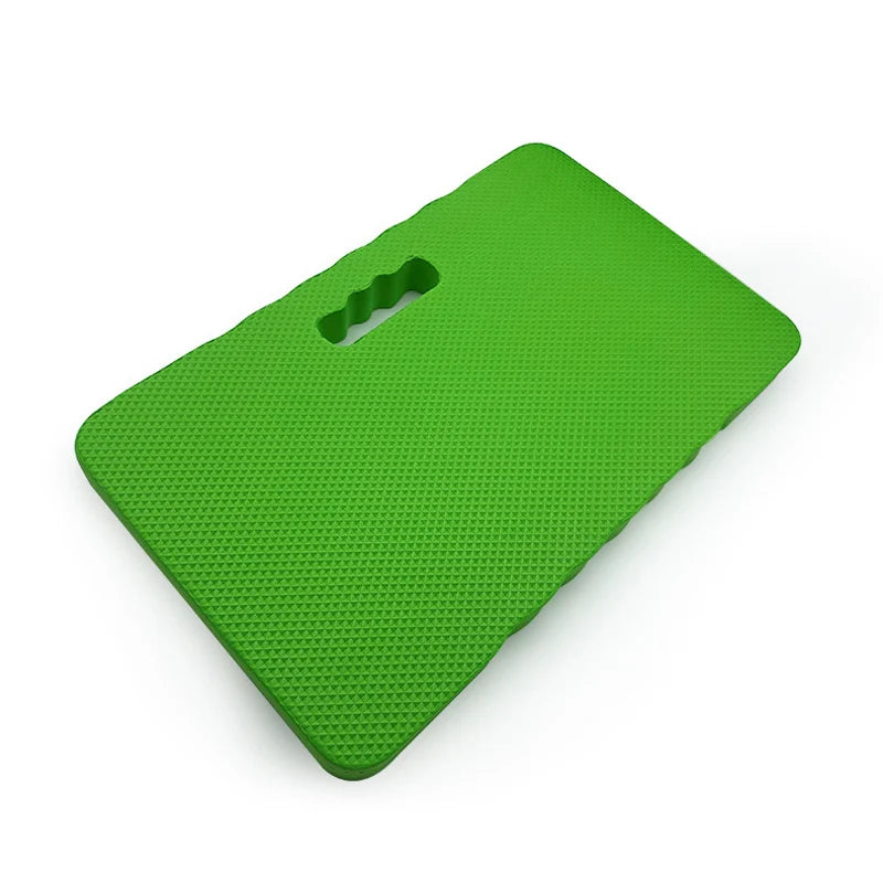 A bright green, thick protective kneeling mat designed for use on hard floors.