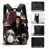 Black backpack featuring a motorcycle theme with a person riding a bike and various accessory details.
