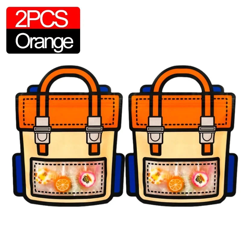 Two orange cartoon birthday and party goodie bags with colorful candies inside