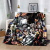 A retro printed flannel throw blanket featuring a collage of portrait photographs in black and white tones.