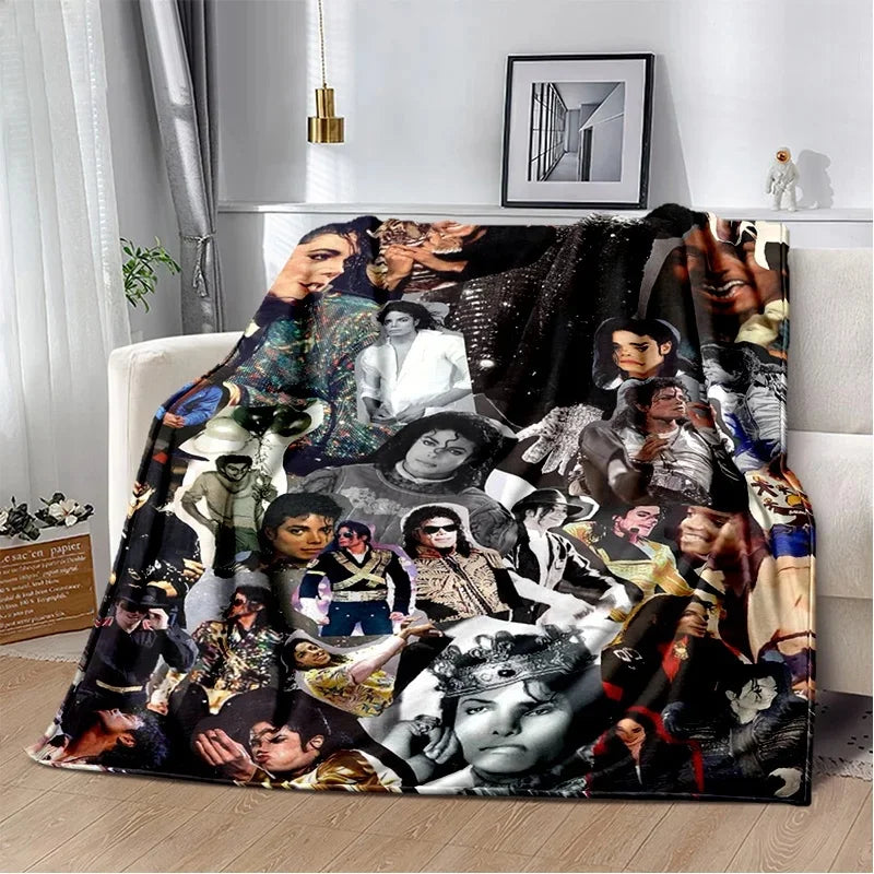 A retro printed flannel throw blanket featuring a collage of portrait photographs in black and white tones.